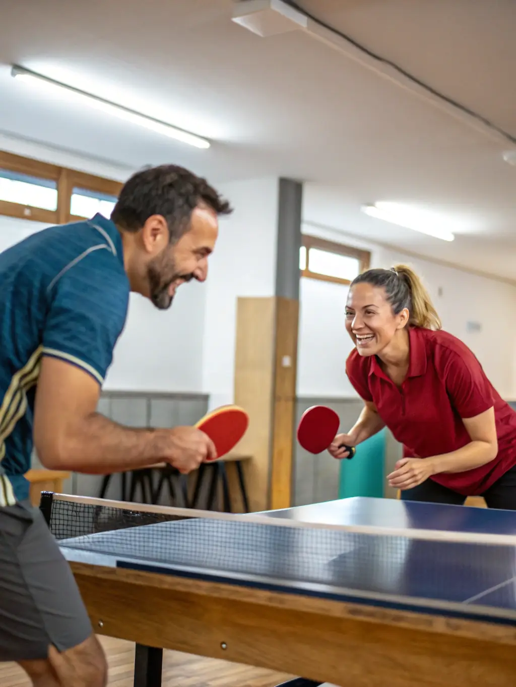 A vibrant image of club members engaged in a friendly table tennis match at CSM, highlighting the recreational aspect of the sport.